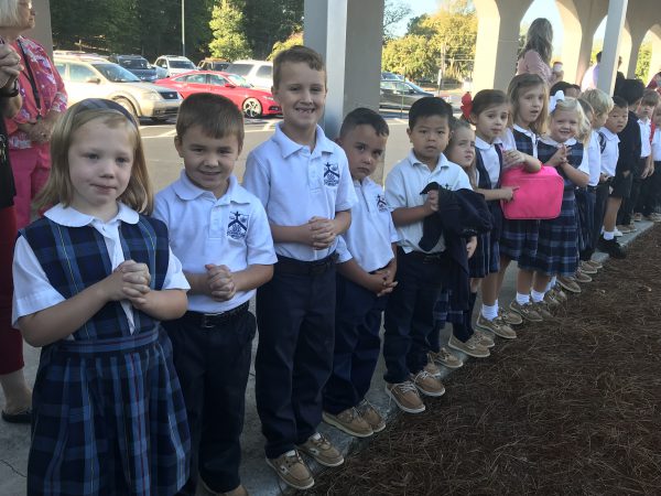 Children line up in Saint Mary's School uniforms