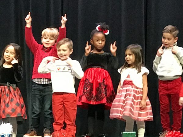 Children perform in red, white and black